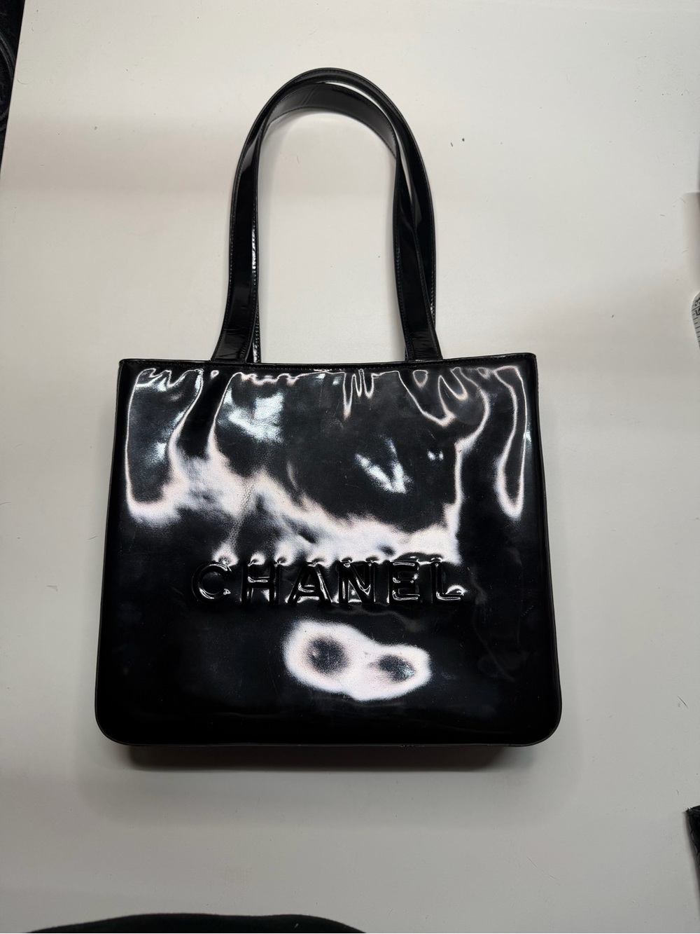 CHANEL Black Patent Leather Embossed Logo Tote
